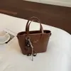 Bolso de Mujer 2026 Primavera Nuevo Bolso de Cuero PU de Gran Capacidad Bolso de Hombro y Mano para Mujer Bolso Tote de Gama Alta de Nicho para Viajes