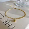 Tornozeleira Corrente Elo Bola Dourada Pequena para Mulheres Verão Versátil Chamativa Corrente de Pé Sexy Personalidade Design de Nicho Presente