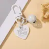 Estilo Casual y Lindo Llavero Colgante de Campana con Corazón Pintado Colorido Funda para Teléfono Móvil Bolso Auriculares Set de Accesorios Pequeños
