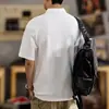 Camisa polo minimalista de manga corta estilo japonés, camisa holgada de talla grande para hombre, camiseta casual de verano extragrande con cuello de solapa