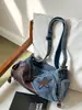 2026 Nuevo Bolso de Hombro Único de Mezclilla Estilo Coreano Bolso Cruzado para Mujer de un Solo Hombro para el Trabajo Bolso Retro Forma de Empanada