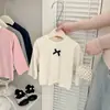 Roupa Íntima Feminina Estilo Coreano para Primavera e Outono 2026 Nova Camiseta Elegante com Laço para Bebês Roupas Versáteis para Bebês