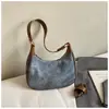 Bolsa de Design de Nicho em Forma de Meia-Lua Feminina 2025 Novo Estilo Coreano Retrô Ombro Único Transversal Pequena Bolsa Estilo Ocidental Bolsa de Dumpling Transfronteiriça