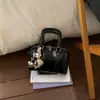 Bolsa tipo almohada dulce para mujer 2026 Nuevo estilo de alta gama Lujo ligero Bolso de mano simple Bolso de hombro cruzado versátil y elegante