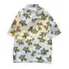 Camisa de solapa de manga corta de verano 2025, moderna, estilo Ins japonés, retro, casual, holgada, con estampado de flores hawaianas, camisa fina
