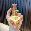 Woan coolomi llavero colgante cubo de Rubik al por mayor mini portátil cubo de Rubik colgante juguete educativo