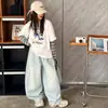 Conjunto de Ropa de Primavera para Niñas Mayores 2026 Nuevo Elegante Top Falso de Dos Piezas y Jeans para Primavera y Otoño