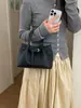Bolso de diseño nicho 2026 nuevo modelo moda transfronteriza versátil bolso de hombro cruzado bolso de mano casual