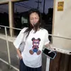 Camiseta blanca de manga corta con hombros caídos, estilo europeo de nicho de diseñador, para mujer, holgada, nueva tendencia de verano 2026, camiseta top