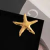 Broche de Metal Aço Inoxidável Europeu e Americano Estilo Feriado Estrela do Mar Prateada Litoral Criativo Moda de Ponta Nicho Peito