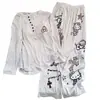 Nuevo conjunto de pijama acanalado de seda helada para mujer 2026, con mangas largas, pantalones largos y un lindo diseño de gato de dibujos animados, perfecto para un look relajado y cómodo de ropa de estar en casa