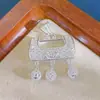 Flor de Peonía Hueca de Plata Pura Borla de Bola de Seda Colgante con Cierre de Plata con un Diseño de Nicho, Elegante y de Lujo Ligero