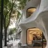 Fachada de UHPC con curvas irregulares para tiendas de marca de moda, pared exterior aerodinámica, 3D curvado resistente a la intemperie para exteriores