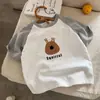 Camiseta de verano para niños de algodón puro de manga corta, diseño moderno estilo coreano con bloques de color, unisex, estampado de dibujos animados, top versátil de media manga para niños mayores