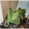 Bolso de lona nuevo con un toque de alta gama, bolso tote cruzado, diseño de nicho, versátil para ir al trabajo, bolso de hombro, bolso tote