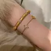 Pulsera de Trébol de Cuatro Hojas con Circonita Galvanizada en Oro Real Luz de Lujo Moda de Gama Alta Retro Pulsera de Personalidad Pulsera de Temperamento Venta al por Mayor