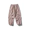 Conjunto Externo Três Provas Frota Negra: Conjunto de Duas Peças: Jaqueta com Gola Alta e Capuz Escondido e Calça Wide-Leg Patchwork Workwear
