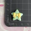 Creativo Lazo Doble Estrella Dibujos Animados Estilo Nuevo Accesorios de Resina DIY Pegamento de Crema Funda para Teléfono Móvil Paquete de Materiales al por Mayor