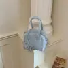 Bolso de hombro para debajo del brazo de diseño nicho transfronterizo, nuevo bolso de mujer primavera 2026, bolso cuadrado pequeño simple de alta calidad
