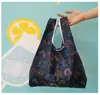 Bolsa cuadrada de tela de flores al por mayor bolsa de compras plegable de tela de poliéster publicidad supermercado almacenamiento portátil bolsa de fresa protección del medio ambiente