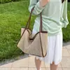 La popular bolsa de mano tejida de nicho de este año para mujer, nuevo bolso de hombro calado de verano 2026, bolsa para axila madre-hija