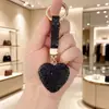 Llavero de Corazón de Diamante Completo de Venta Caliente Cross Colgante de Bolso de Corazón de Melocotón con Pedrería Llavero de Coche Personalidad de Moda Colgante