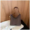 Bolso de axila para mujer muy elegante, nuevo modelo de verano 2026, bolso de mano simple a rayas estilo coreano, bolso de hombro, bolso cruzado, bolso para el trabajo