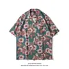 Cuello de solapa 2026 Estilo nuevo Camisa floral para hombre Estilo coreano Holgada Moda Estampada Estilo playero Casual Camisa de manga corta Exportación