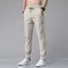 Los nuevos pantalones casuales para hombre de Chao Lunbu, exclusivamente para ventas transfronterizas, son de secado rápido, de pierna recta para verano, estilo coreano, pantalones deportivos finos para hombre.