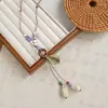 Collar más vendido del Libro Rojo Colección Nuevo Estilo Étnico Chino Cerámica Cadena Larga de Lana para Mujer Accesorios Colgantes Antiguos Mujer