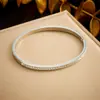 Europa y Estados Unidos moda transfronteriza simple elegante temperamento no se decolora chapado en oro diamante geométrico redondo liso acero inoxidable pulsera