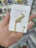 Broche de Traje de Lujo Estilo Coreano Pin de Cadena para Traje Corsage Personalizado de Nota de Instrumento Musical Estilo Británico Venta al por Mayor
