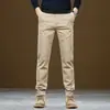 Pantalones casuales negros de tecnología de tres pruebas para hombre de otoño e invierno, pantalones largos de algodón elásticos holgados de pierna recta con forro polar