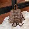 Mochila de cuadros, simple, invierno, moda femenina, nuevo 2026, doble hombro, bandolera, caricatura, estilo coreano, colgante, un hombro