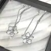Pendientes Colgantes con Borla de Cuentas Redondas Flor de Diamante Blanco para Mujer Lujo Ligero Diseño de Nicho Alta Moda Nuevo Estilo Personalidad Versátil de Moda