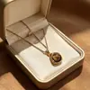 Collar Estilo Melanoidio Ojo de Tigre Versátil para el Viaje Diario Retro Europeo y Americano Ágata Negra Ovalada Ojo de Gato Blanco Cadena para la Clavícula para Mujeres