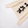 Venta al por mayor transfronteriza Verano 2025 Nuevo estilo europeo y americano para mujer Falda corta amarilla estilo Cardigan de punto de manga larga con cuello redondo