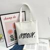 Bolso de mano lindo de un solo hombro Bolso de maquillaje para clase de estudiante universitario bolsa de compras de gran capacidad Bolso de lona fresco artístico para mujer