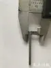 Máquina de Bordado por Computadora Partes Máquina de Alta Velocidad Aguja Hilo Pinza Solenoide Varilla de Accionamiento Bloqueo de Hilo Bandera Roja Pequeña Placa Protectora Soporte