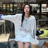 Camiseta básica T-shirt relaxada e casual estilo coreano para mulheres, novo modelo primavera e outono 2026, corte solto, top de manga comprida que cobre os quadris
