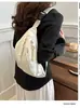 Riñonera de nailon 2026 nuevo estilo bandolera para el pecho bolsa casual de lona para mujer de moda color liso deportiva nicho versátil venta directa