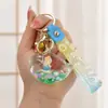 Llavero con Arena Líquida en Botella de Aceite, Botella que Brilla en la Oscuridad, Llavero de Ballena, Colgante Exquisito para Bolso, Lindo Accesorio para Llavero