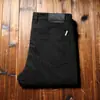 Estación europea hombres lujo ligero otoño e invierno grueso cliente suministrado personalizado tejido importado color primario mezclilla microelástico PU lavado corte ajustado jeans