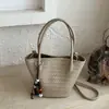 Bolso tejido de patrón único para mujer, nuevo bolso de mano de alta gama vintage otoño 2026, bolso de hombro y bandolera tipo cubo