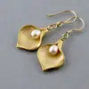 Pendientes de Perla con Forma de Pétalo Estilo Coreano de Venta Caliente Transfronteriza Pendientes de Flor Elegantes para Damas Moda Europea y Americana Fabricantes de Joyería al por Mayor