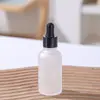 Botella de aceite de esencia transparente vidrio esmerilado líquido de esencia botella para rellenar botella con gotero de cabeza de goma muestra cosmética botella vacía venta al por mayor