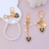 Llavero Estilo Tweed Lazo Colgante de Corazón Cadena de Perlas Llavero Colgante para Bolsos y Teléfonos Móviles Manualidades para Niñas