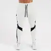 Nuevos pantalones deportivos transfronterizos para hombre para correr, fitness y uso casual, con cordón, pantalones de entrenamiento ajustados, pantalones casuales elásticos, corte slim