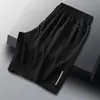 Pantalones Cortos Casuales de Verano para Hombre Estilo Coreano Moderno Bolsillo Cremallera Baratos de Longitud Media Cintura Elástica Pantalones Delgados de Seda de Hielo para Hombre
