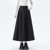 Foto real de falda midi para mujer, nueva falda plisada de línea A de cintura alta para otoño 2026, falda tipo paraguas de color liso que cubre la cadera y con dobladillo grande
